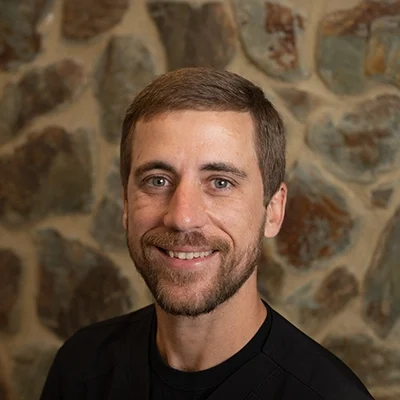 Will Smiling In Front Of Cobble Wall